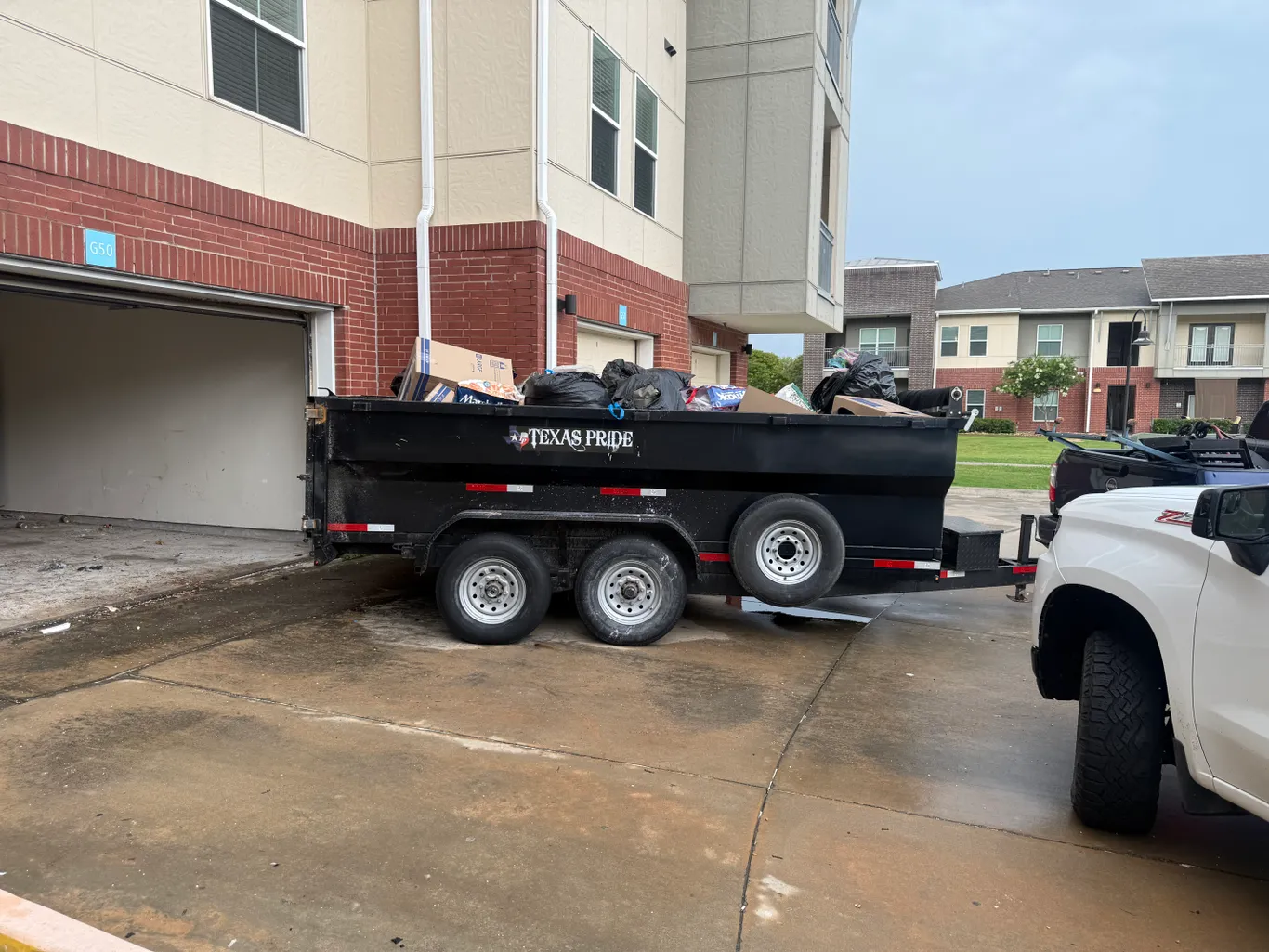 Junk Busters truck loaded with furniture and appliances in Corpus Christi, TX